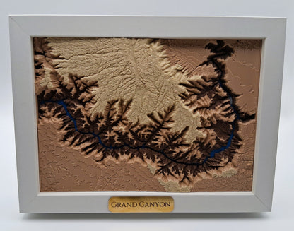 Framed topographic map of the Grand Canyon on a white background