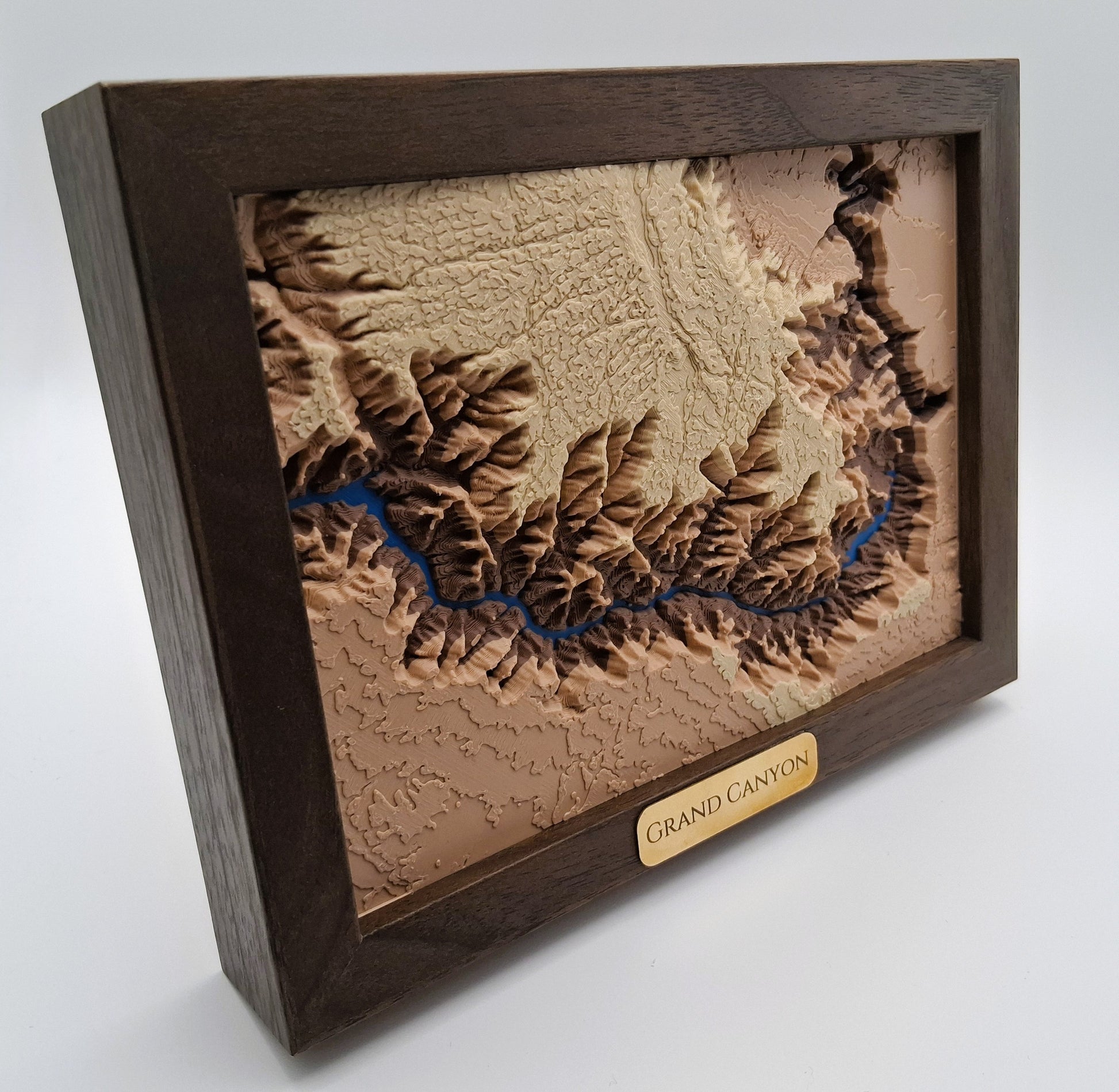 Wooden framed relief map of the Grand Canyon on a white background