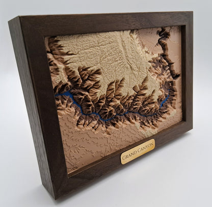 Wooden framed relief map of the Grand Canyon on a white background