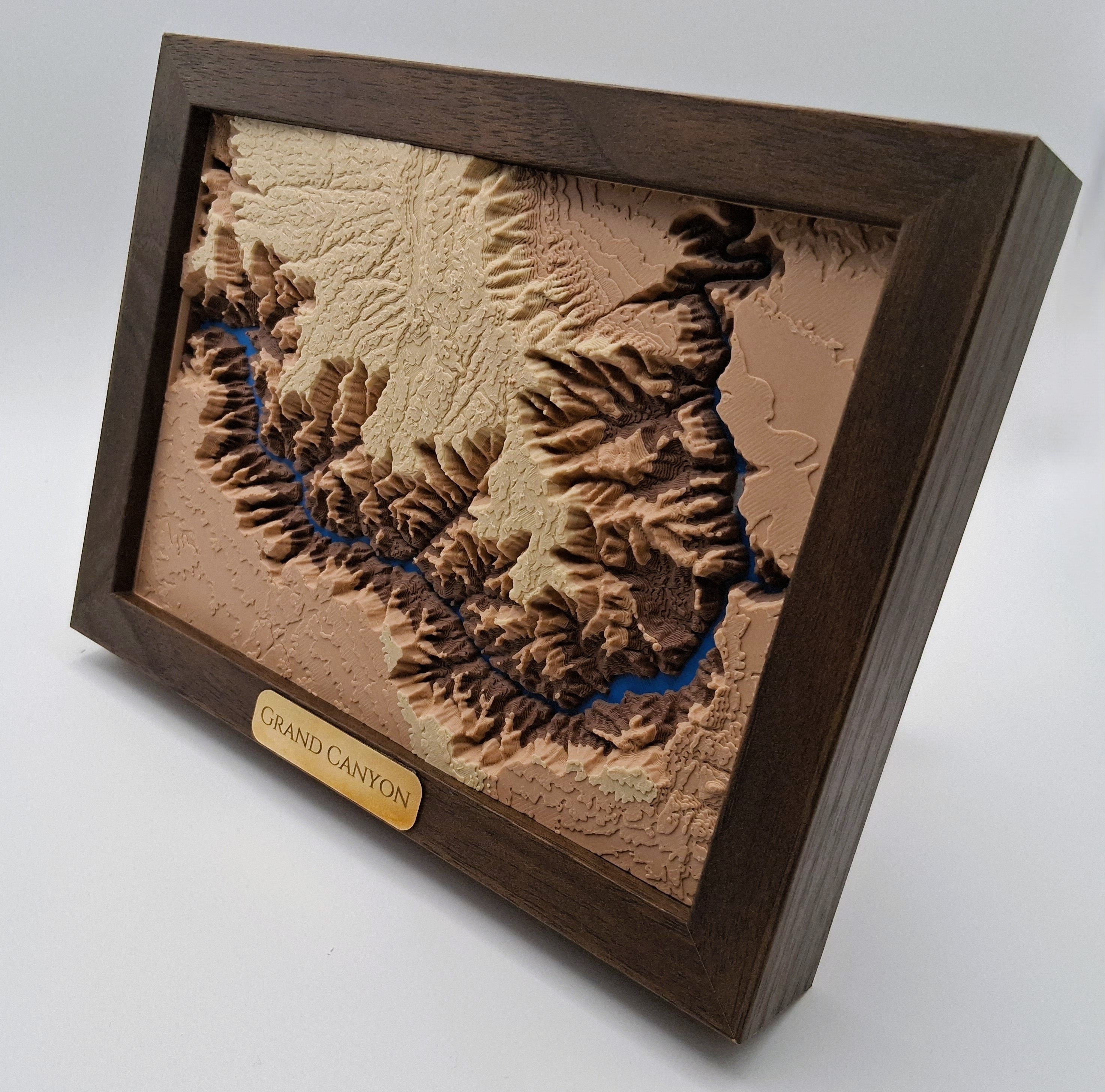 3D model of the Grand Canyon in a wooden frame on a white background