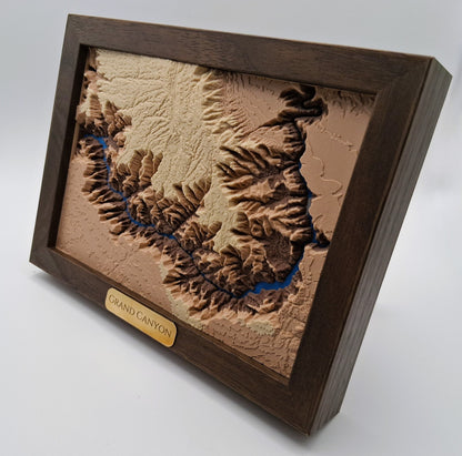 3D model of the Grand Canyon in a wooden frame on a white background