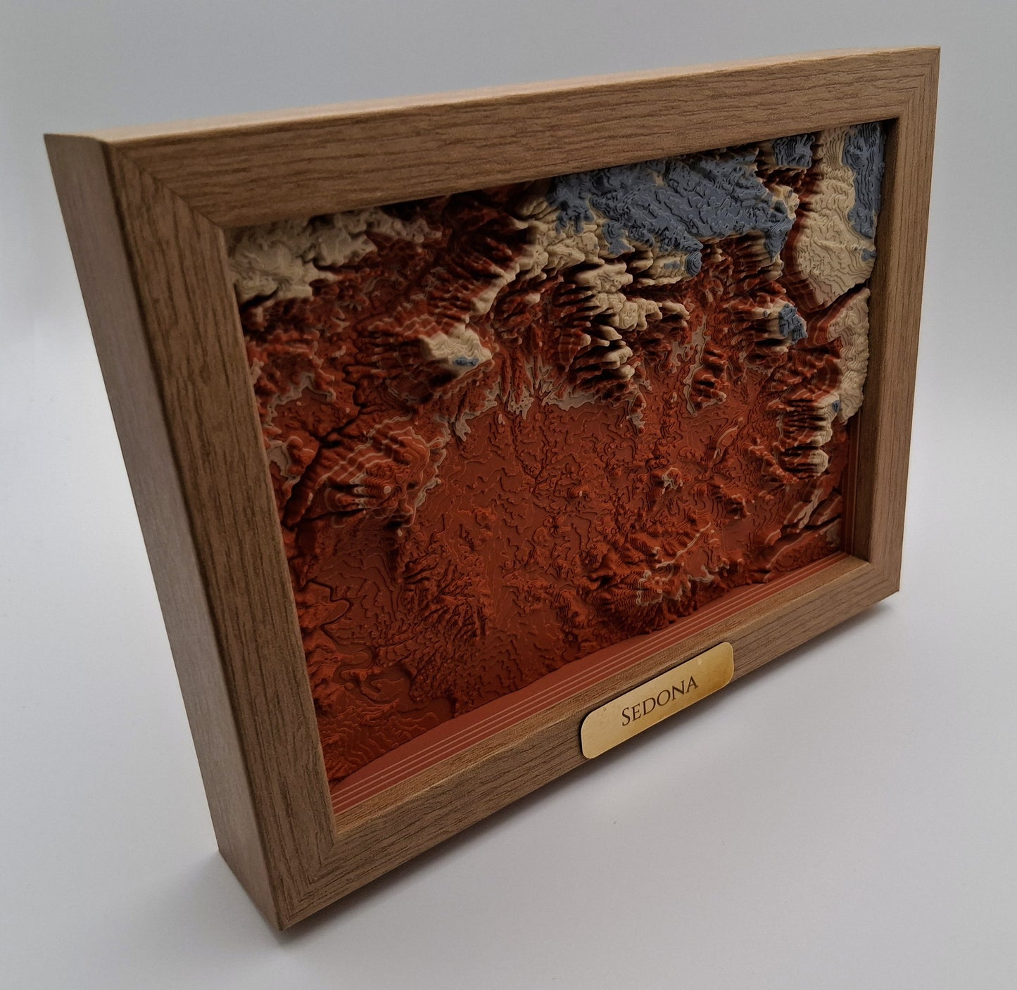 Wooden framed topographic map of Sedona on a white background