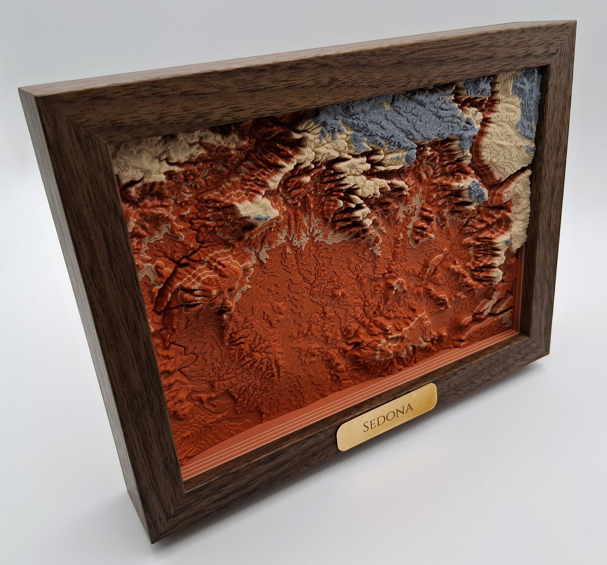 Wooden framed topographic map of Sedona on a white background