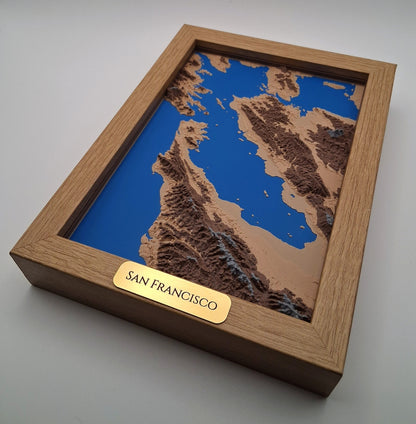 Wooden box with a topographic model of San Francisco on a gray background
