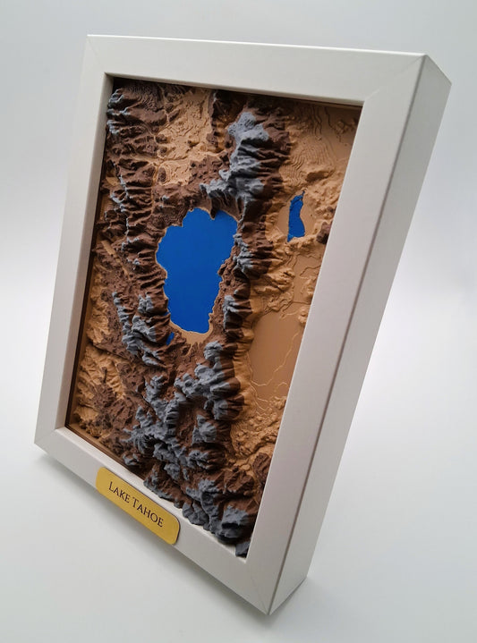 Topographic model of Lake Tahoe in a white frame on a light gray background