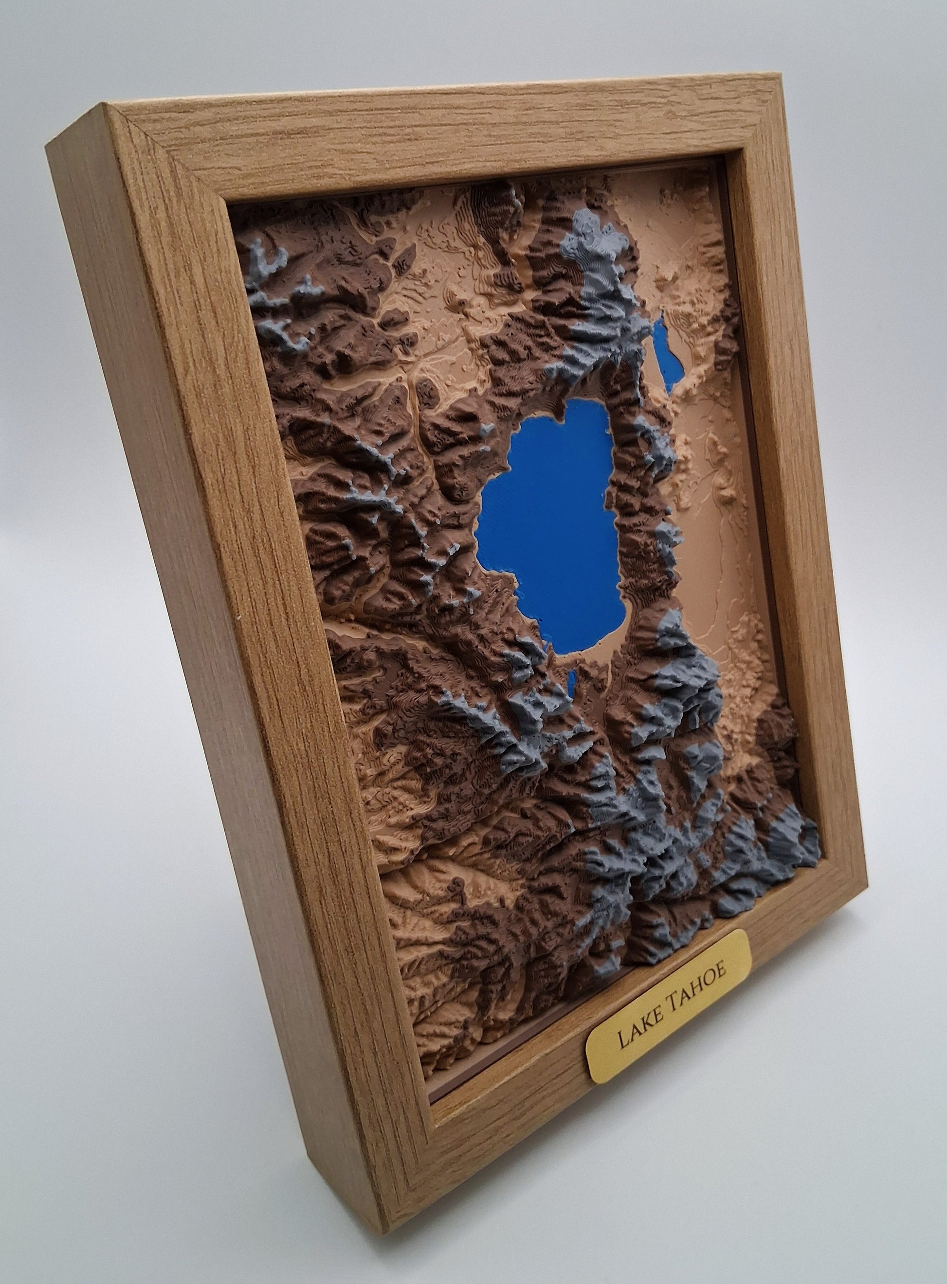 3D mountain landscape model in a wooden frame with 'Lake Tahoe' label
